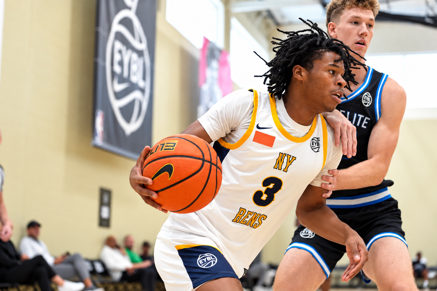 NY Rens player in a white number 3 jersey driving with the ball during a basketball game